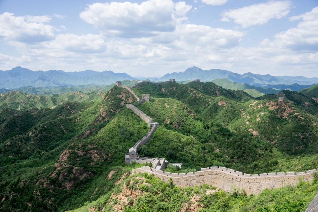 Crumbling Great Chinese Wall running down a hill, Huanghua Great Wall of  China, Great Wall